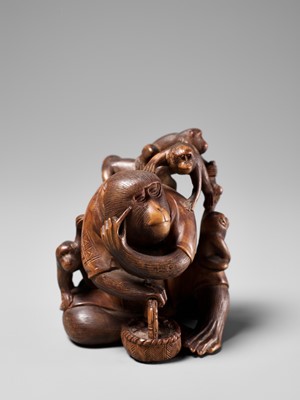 Lot 258 - KOGETSU: A WOOD OKIMONO OF A ROBED MONKEY WITH SEVERAL YOUNG