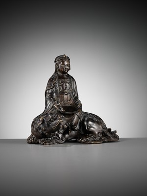 Lot 661 - A BRONZE FIGURE OF WENSHU (MANJUSHRI) ON A LION, LATE MING TO EARLY QING DYNASTY