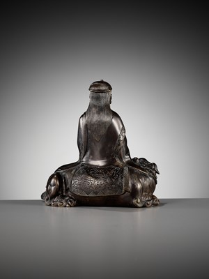 Lot 661 - A BRONZE FIGURE OF WENSHU (MANJUSHRI) ON A LION, LATE MING TO EARLY QING DYNASTY