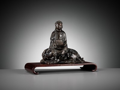 Lot 661 - A BRONZE FIGURE OF WENSHU (MANJUSHRI) ON A LION, LATE MING TO EARLY QING DYNASTY