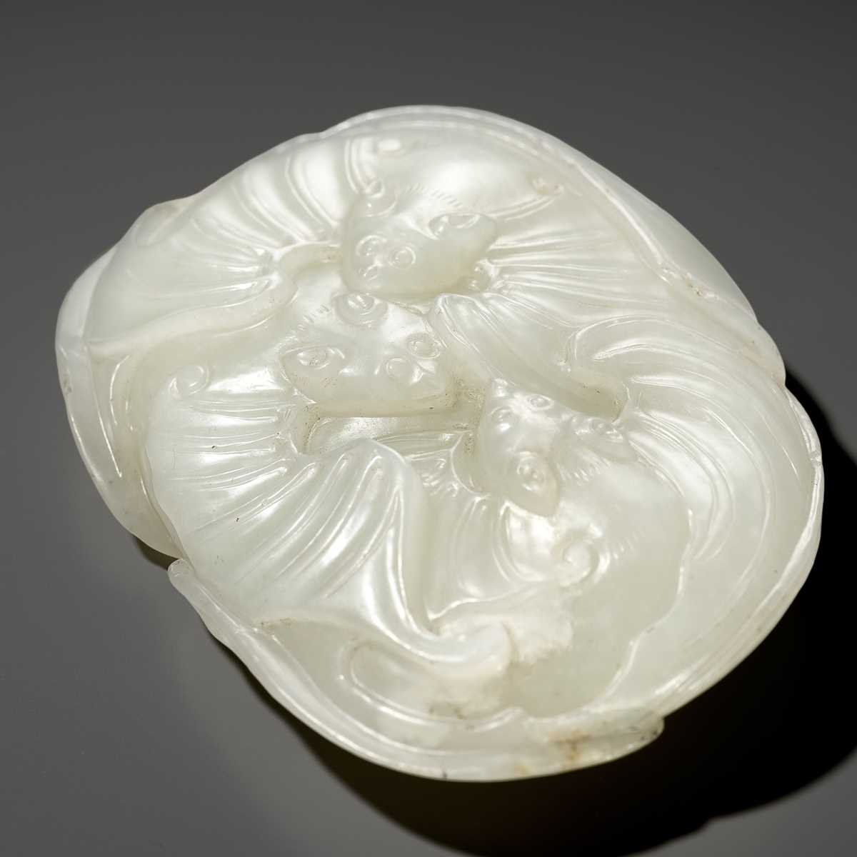 Lot 97 - A RARE AND FINE WHITE JADE ‘FIVE BATS’ (WUFU) WEIGHT, 18TH CENTURY