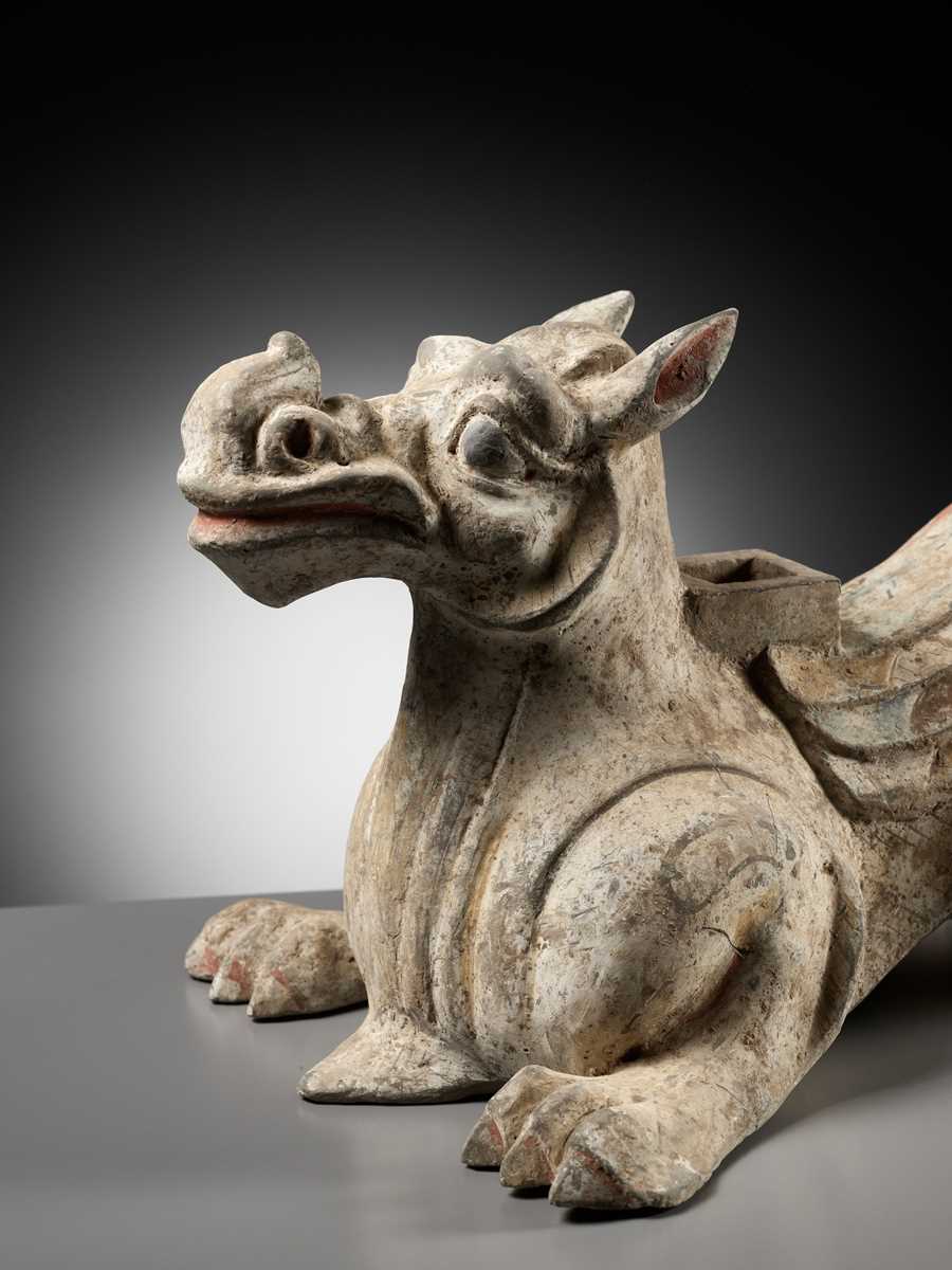 Lot 62 - A PAINTED POTTERY ‘MYTHICAL BEAST’ STAND, EASTERN HAN DYNASTY