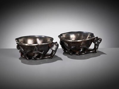 Lot 16 - A PAIR OF SILVER-LINED ZITAN ‘MAGNOLIA’ LIBATION CUPS, CHINA, 18TH CENTURY