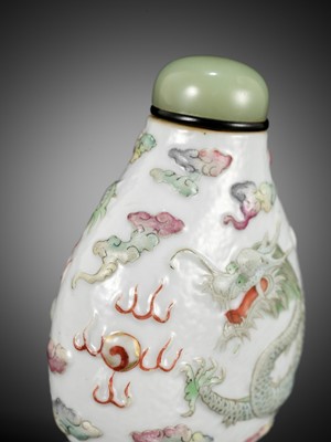 Lot 60 - A MOLDED AND CARVED ‘DRAGON’ FAMILLE ROSE PORCELAIN SNUFF BOTTLE, SIGNED LIQUAN, CHINA, 1853-1864