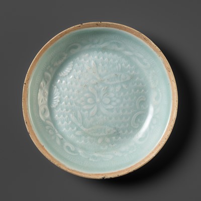 Lot 509 - A MOLDED QINGBAI ‘DOUBLE FISH’ DISH, SOUTHERN SONG DYNASTY