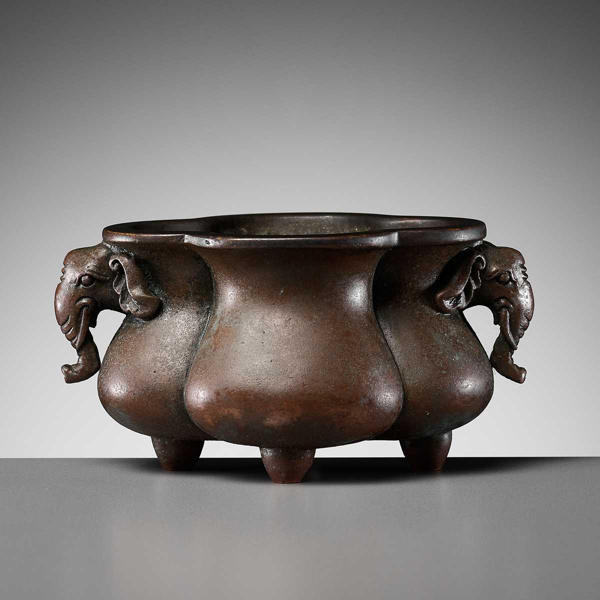 Lot 113 - A SMALL QUATREFOIL ‘ELEPHANT’ BRONZE INCENSE BURNER, EARLY QING DYNASTY