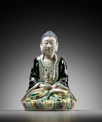 Lot 530 - A FAMILLE VERTE BISCUIT FIGURE OF BUDDHA, QING DYNASTY