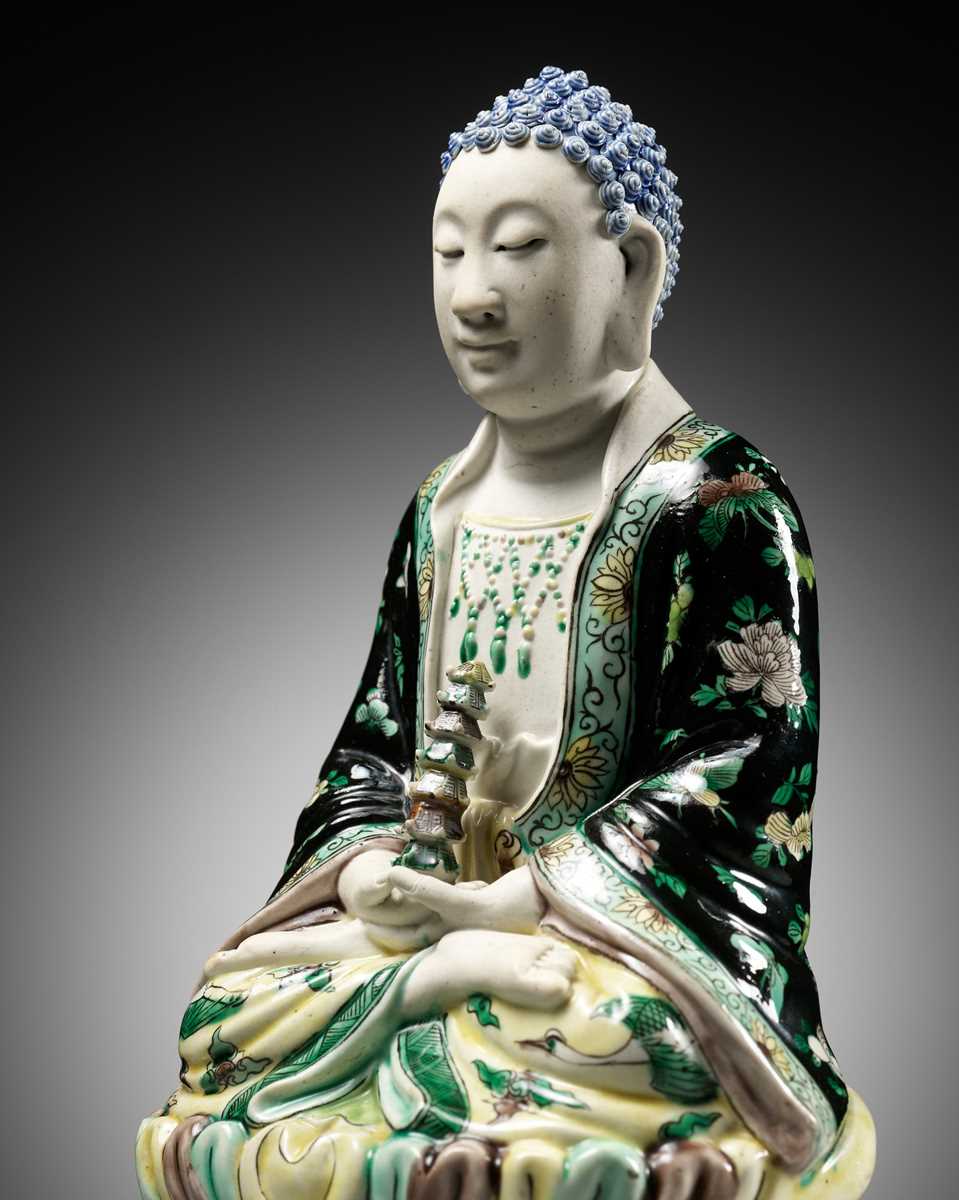 Lot 530 - A FAMILLE VERTE BISCUIT FIGURE OF BUDDHA, QING DYNASTY