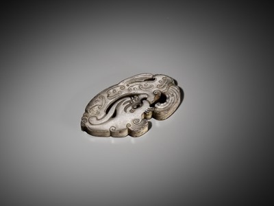 Lot 1053 - A GRAY JADE ‘DRAGON’ PENDANT, LATE MING TO EARLY QING DYNASTY