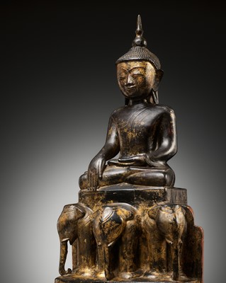 Lot 247 - A LARGE GILT AND LACQUERED WOOD SCULPTURE OF BUDDHA SHAKYAMUNI, BURMA, 17TH-18TH CENTURY