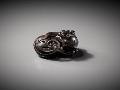 Lot 111 - A BRONZE ‘BUDDHIST LION’ SCROLL WEIGHT, LATE MING DYNASTY