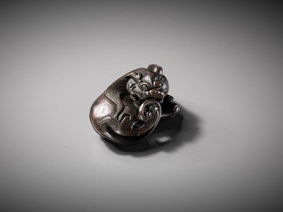 Lot 111 - A BRONZE ‘BUDDHIST LION’ SCROLL WEIGHT, LATE MING DYNASTY