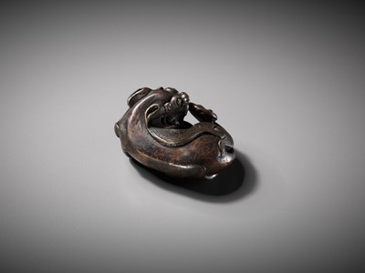 Lot 111 - A BRONZE ‘BUDDHIST LION’ SCROLL WEIGHT, LATE MING DYNASTY