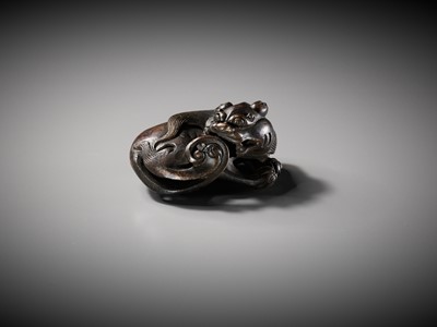 Lot 111 - A BRONZE ‘BUDDHIST LION’ SCROLL WEIGHT, LATE MING DYNASTY