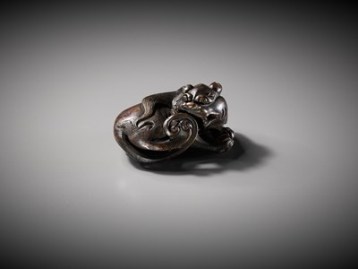 Lot 111 - A BRONZE ‘BUDDHIST LION’ SCROLL WEIGHT, LATE MING DYNASTY