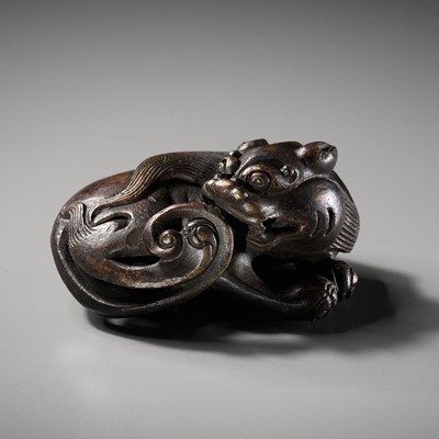 Lot 111 - A BRONZE ‘BUDDHIST LION’ SCROLL WEIGHT, LATE MING DYNASTY