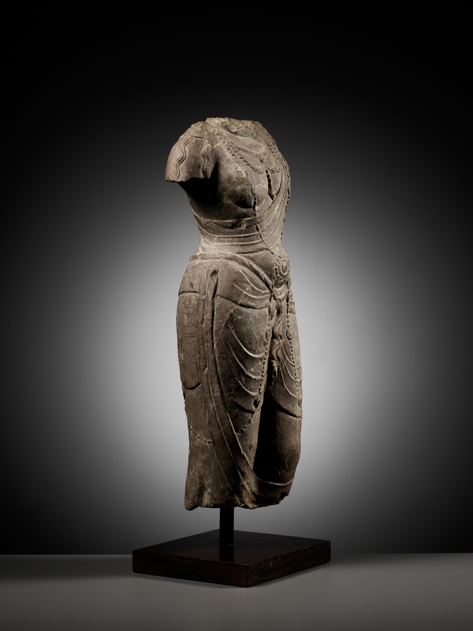 Lot 171 - A LIMESTONE TORSO OF A BODHISATTVA, TANG