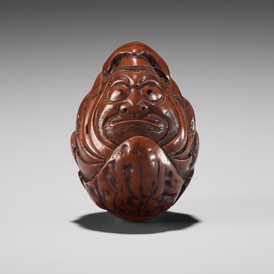 Lot 376 - A KURUMI (WALNUT) NETSUKE OF A ROLY POLY DARUMA