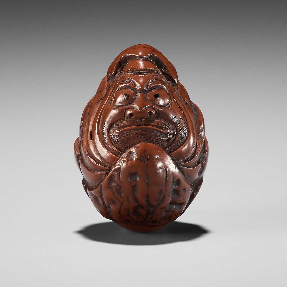 Lot 376 - A KURUMI (WALNUT) NETSUKE OF A ROLY POLY DARUMA