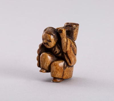 Lot 762 - A STAG ANTLER NETSUKE OF A SHOJO WITH LADLE, EDO PERIOD