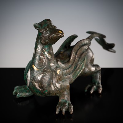 Lot 1007 - A SILVER- AND GOLD-INLAID ‘MYTHICAL BEAST’ BRONZE, CHINA, 17TH-18TH CENTURY