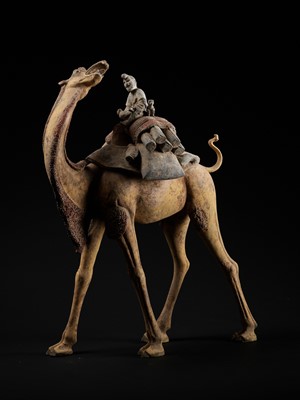 Lot 67 - AN EXCEPTIONALLY LARGE PAINTED POTTERY FIGURE OF A BACTRIAN CAMEL WITH RIDER, MONKEY AND SLAIN GOATS, TANG DYNASTY