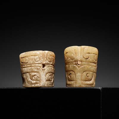 Lot 424 - TWO YELLOW JADE ‘TAOTIE’ BEADS, SHANG TO WESTERN ZHOU DYNASTY