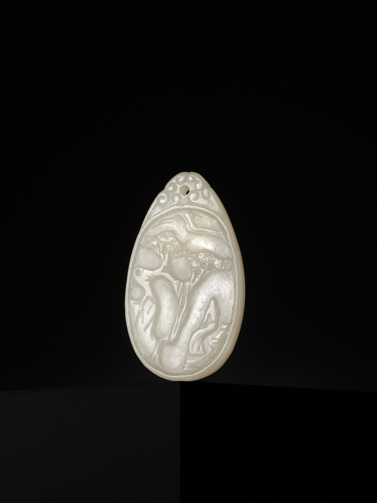 Lot 1753 - A WHITE JADE MINIATURE PENDANT, SIGNED