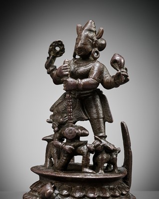 A BRONZE FIGURE OF DURGA SLAYING THE BUFFALO-DEMON MAHISHA, ORISSA, EASTERN INDIA, 13TH-14TH CENTURY