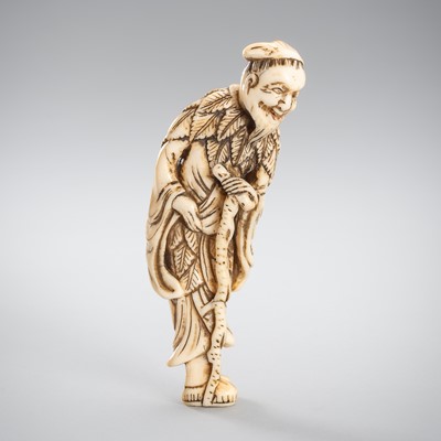 Lot 275 - A TALL IVORY NETSUKE OF TEKKAI SENNIN