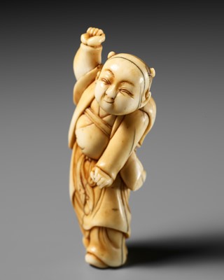 AN IVORY NETSUKE OF A DANCING KARAKO