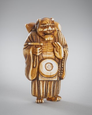 Lot 1550 - AN IVORY NETSUKE OF AN ONI NEMBUTSU
