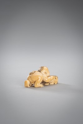 Lot 342 - A SMALL IVORY NETSUKE OF A BOY WITH A DRUM