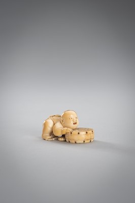Lot 342 - A SMALL IVORY NETSUKE OF A BOY WITH A DRUM