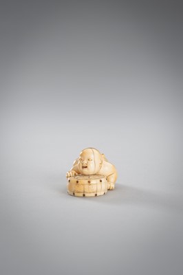 Lot 342 - A SMALL IVORY NETSUKE OF A BOY WITH A DRUM