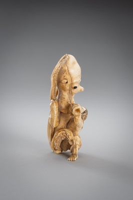 Lot 313 - A FINE IVORY OKIMONO OF A MAN FIGHTING AN OCTOPUS