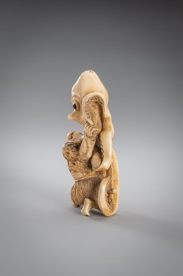 Lot 313 - A FINE IVORY OKIMONO OF A MAN FIGHTING AN OCTOPUS