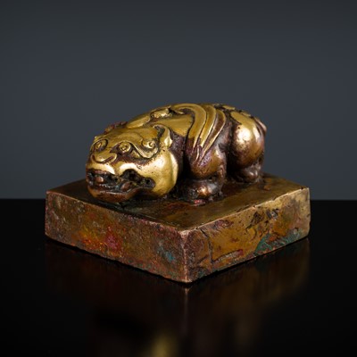 Lot 316 - A RARE AND IMPORTANT MONGOLIAN ‘LONG LIFE AND BOUNDLESS TERRITORIES’ GILT-BRONZE SEAL, DEPICTING A BIXIE, YUAN DYNASTY