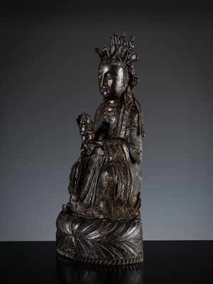 Lot 73 - A BRONZE FIGURE OF SONGZI GUANYIN AND CHILD, MING DYNASTY