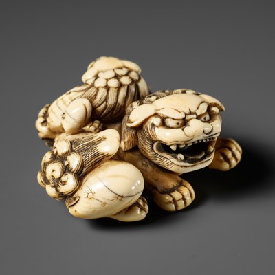 Lot 415 - A FINE IVORY NETSUKE OF A SHISHI WITH YOUNG