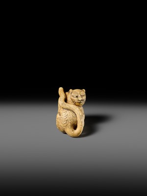 Lot 151 - A POWERFUL OSAKA SCHOOL IVORY NETSUKE OF A CROUCHING TIGER