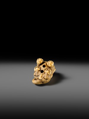 Lot 151 - A POWERFUL OSAKA SCHOOL IVORY NETSUKE OF A CROUCHING TIGER