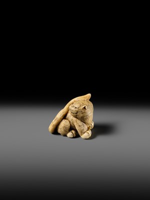 Lot 151 - A POWERFUL OSAKA SCHOOL IVORY NETSUKE OF A CROUCHING TIGER