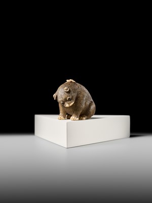 Lot 154 - RAKU: A SUPERB OSAKA SCHOOL IVORY NETSUKE OF A PUPPY AND BUTTERFLY