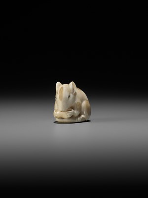 Lot 148 - RANICHI: A FINE IVORY NETSUKE OF A PIEBALD RAT EATING A PEANUT