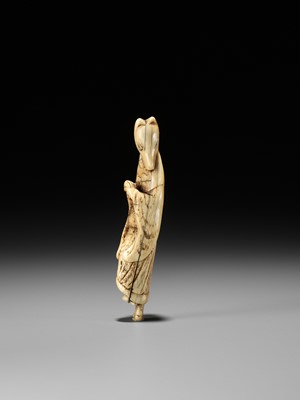 Lot 112 - A GOOD IVORY NETSUKE OF A FOX PRIEST (HAKUZOSU)