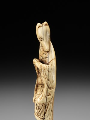 Lot 112 - A GOOD IVORY NETSUKE OF A FOX PRIEST (HAKUZOSU)