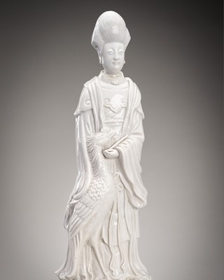 Lot 952 - A BLANC DE CHINE PORCELAIN FIGURE OF JIUTIAN XUANNÜ, c. 1920s