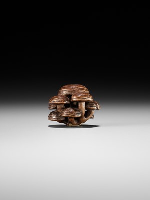 Lot 317 - A WOOD NETSUKE OF REISHI FUNGI