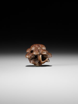 Lot 317 - A WOOD NETSUKE OF REISHI FUNGI